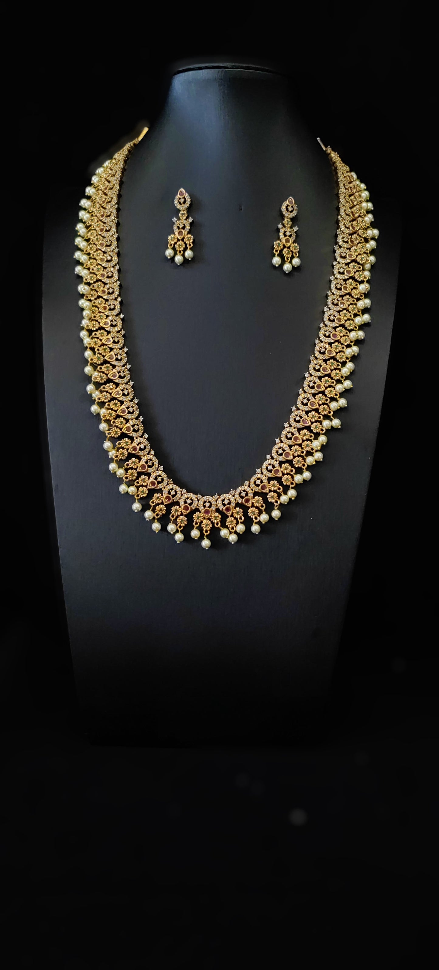 Temple Jewelery: Beautiful antique stone matte Gold finish Long Haram with Earrings