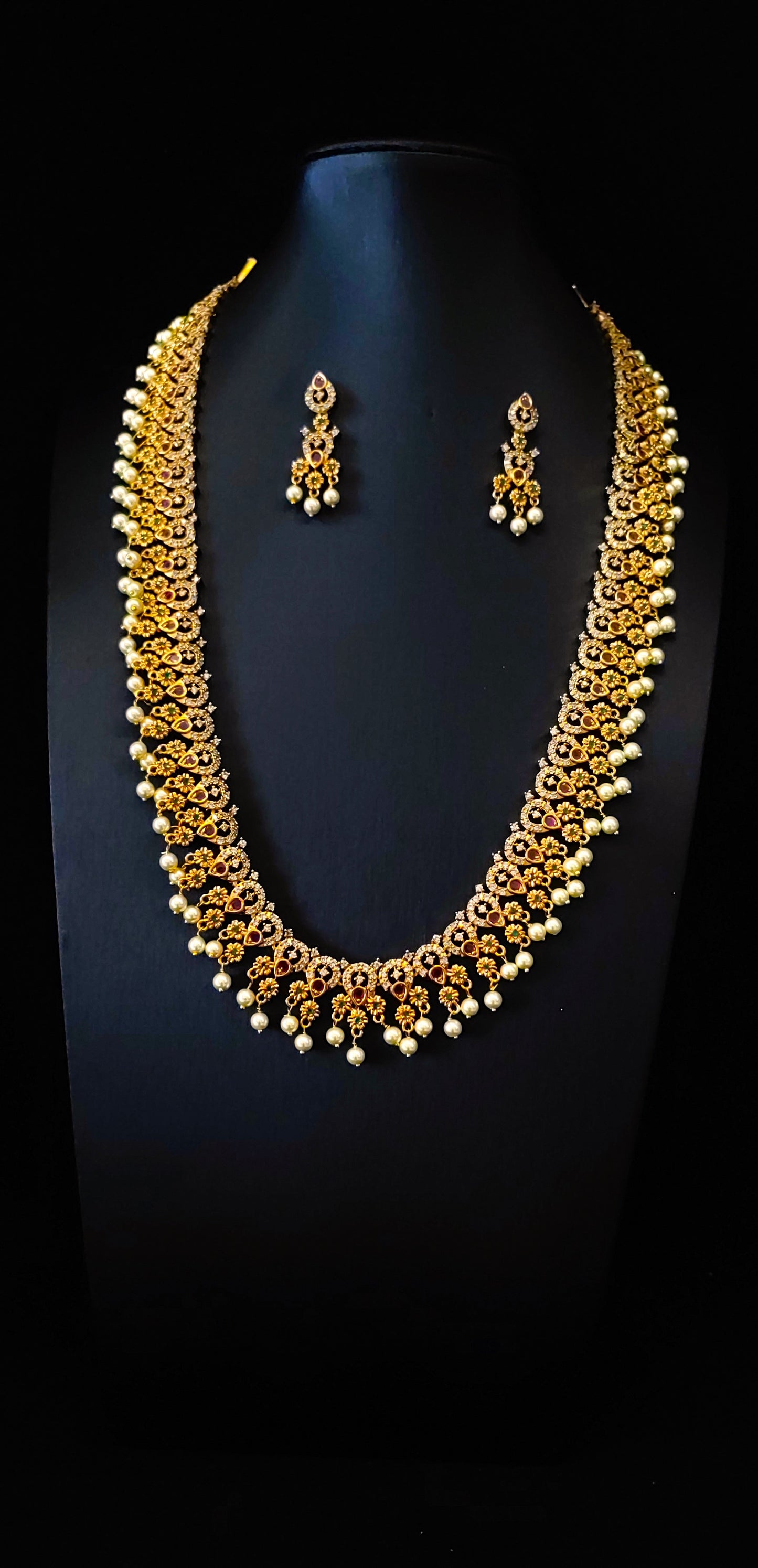 Temple Jewelery: Beautiful antique stone matte Gold finish Long Haram with Earrings
